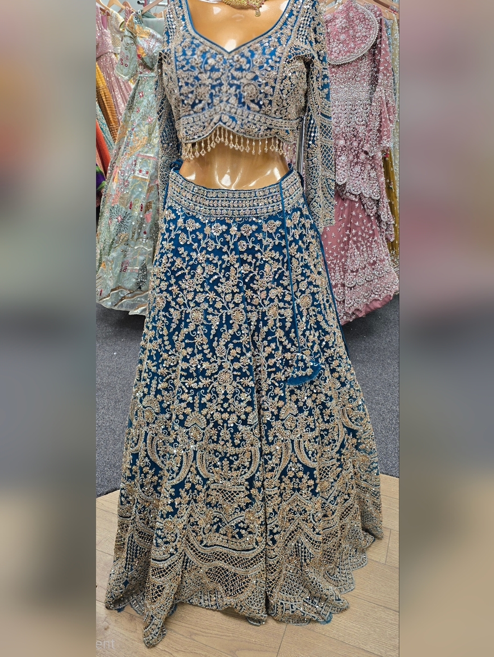 Embroidered Teal Blue Bridal Lehenga with Gold Embellishment